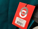 a tag on a blue jacket with a red tag on it