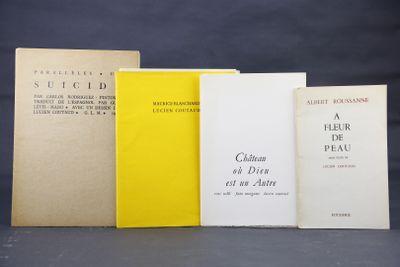 four books are lined up on a table with a black background