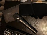 a microphone on a table next to a pair of headphones