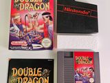 three nintendo games are sitting on a table next to each other