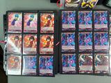 a lot of cards on a table with a pair of scissors