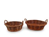 two brown wicker baskets with handles on a white background