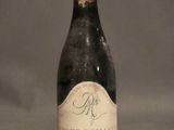 a bottle of wine that is sitting on a table