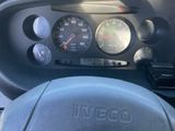 a steering wheel and dashboard of a car with a speedometer