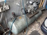 a tank with a motor on it in a garage