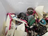 many different types of buttons in a white container