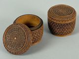 two small wooden boxes sitting next to each other on top of a table