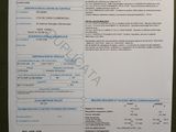 a white paper with blue writing on it sitting on a table