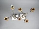 a silver and gold chandelier with five candles