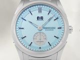 a close up of a watch with a blue dial