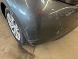 a car that has a denting on the front of it