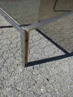 Table basse piètement métallique et plateau de verre fumé. (photo 3)