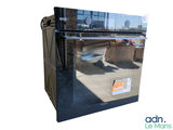 a picture of a refrigerator with a reflection of a building in it