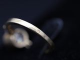 an image of a close up of a ring on a black surface