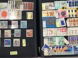 two open cases with stamps on them on a table