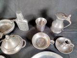 a lot of silver items that are on a table