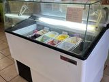 a refrigerated ice cream display in a store