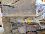 a large stack of boxes that are wrapped in plastic