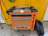 a small orange tool box with tools in it