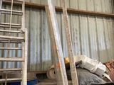 a man that is standing next to some ladders