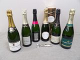 several bottles of champagne are lined up on a table