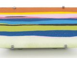 a multicolored piece of art on a white surface