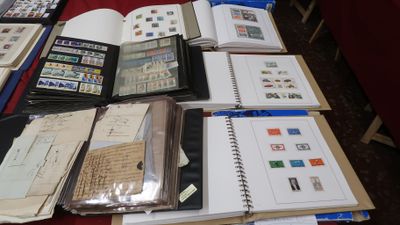 a lot of books on the table with stamps on them