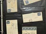 a black binder with a lot of old stamps on it