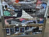 a metal cart with many items in it in a warehouse