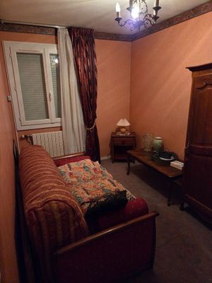 a bedroom with a bed and a dresser in it