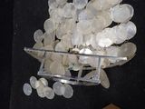 a picture of a bunch of silver coins on a table