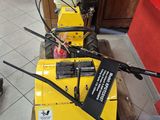 a yellow machine that is sitting on a pallet