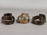 three different types of bracelets are shown on a white surface