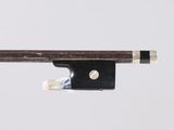 an image of a violin bow with a piece of wood sticking out of it ' s end