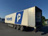 a semi truck that is parked in a parking lot