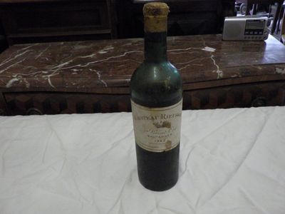 a bottle of wine that is sitting on a table