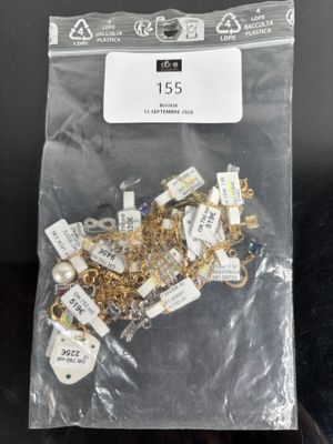 a bag of gold and silver jewelry on a table
