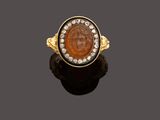 a roman coin and diamond ring