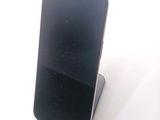 a cell phone that is sitting on top of a stand