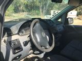 a car dashboard with a steering wheel and a dash board