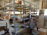 a room filled with lots of shelves and a chair
