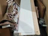 a cardboard box filled with assorted items and a pair of scissors