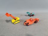 three toy trucks that are sitting next to each other