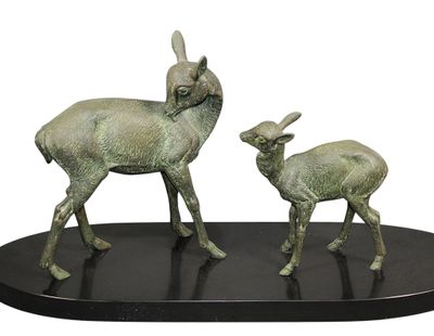 a statue of a deer and a baby deer on a black base