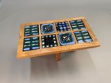 a wooden table with a clock on top of it