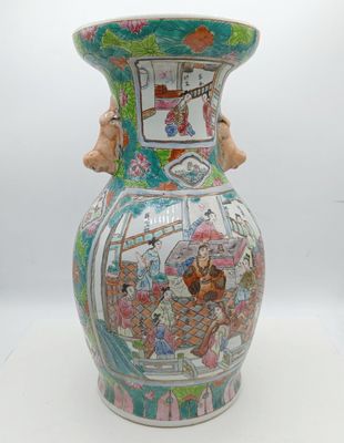a vase that has a picture of people on it