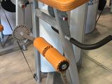 an image of a gym room with a tread machine and other equipment