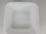 a white bowl that is sitting on a table