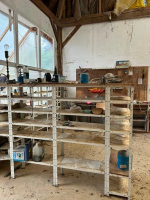 many shelves that are in the middle of a room
