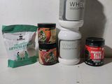 a bottle of whey, a bag of ice cream, and some other items on a counter